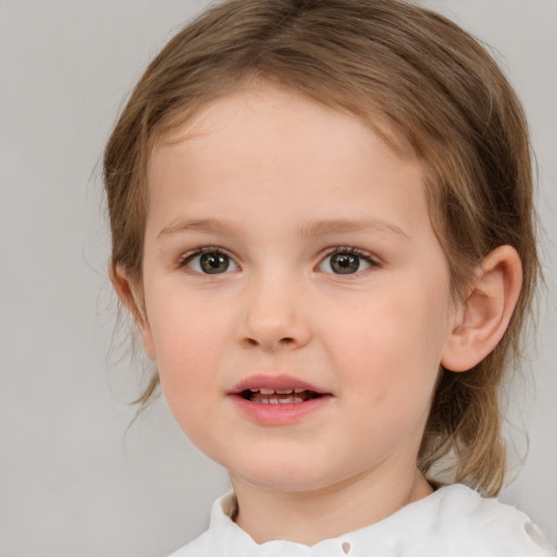 Joyful white child female with medium  brown hair and brown eyes