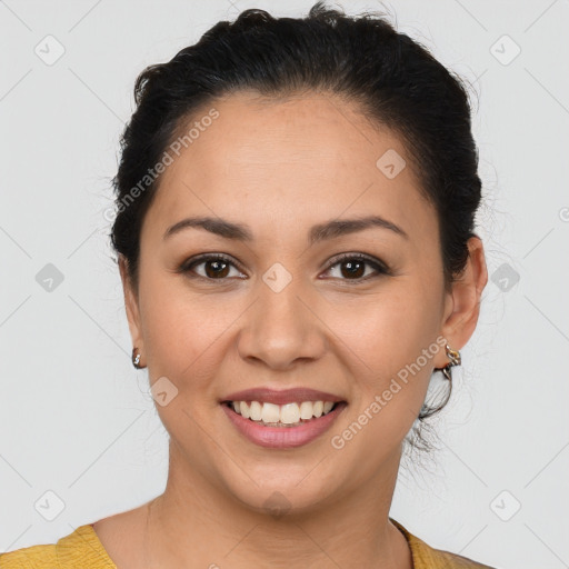 Joyful latino young-adult female with short  brown hair and brown eyes