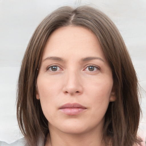 Neutral white young-adult female with medium  brown hair and grey eyes