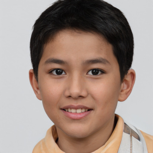 Joyful white child male with short  brown hair and brown eyes