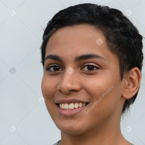 Joyful latino young-adult female with short  black hair and brown eyes