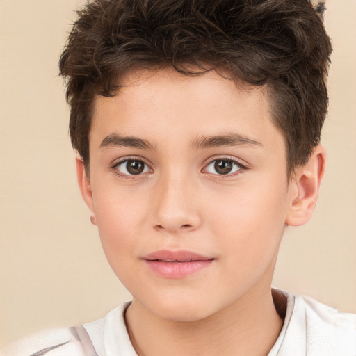 Joyful white child male with short  brown hair and brown eyes