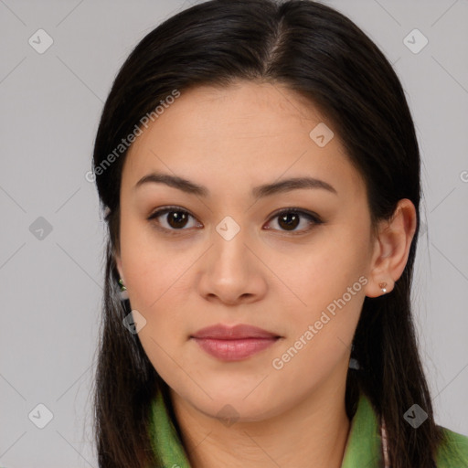 Joyful asian young-adult female with long  brown hair and brown eyes