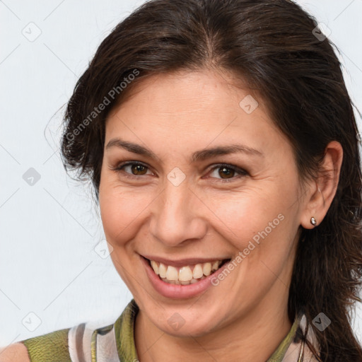 Joyful white adult female with medium  brown hair and brown eyes