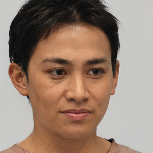 Joyful asian young-adult female with short  brown hair and brown eyes