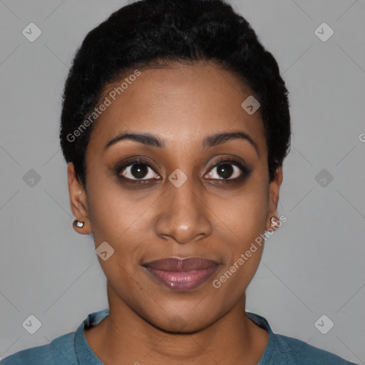 Joyful black young-adult female with short  black hair and brown eyes