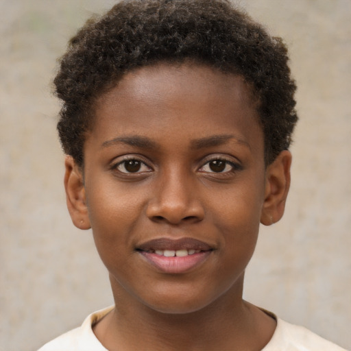Joyful black child female with short  brown hair and brown eyes