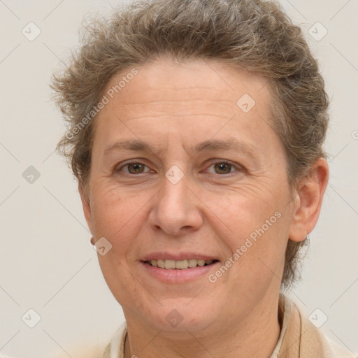 Joyful white adult female with short  brown hair and brown eyes