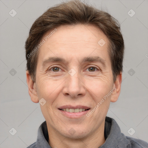 Joyful white adult male with short  brown hair and grey eyes