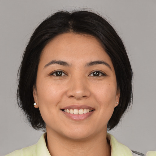 Joyful white young-adult female with medium  brown hair and brown eyes