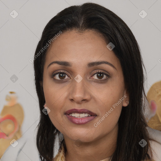 Joyful latino young-adult female with long  brown hair and brown eyes