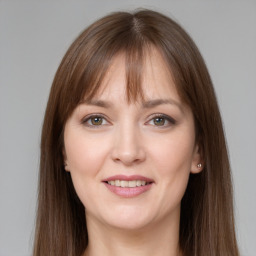 Joyful white young-adult female with long  brown hair and grey eyes