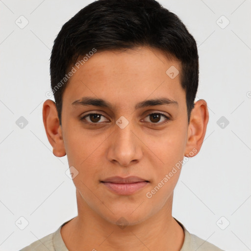 Joyful latino young-adult male with short  brown hair and brown eyes