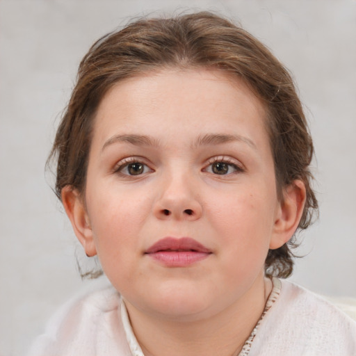 Joyful white child female with medium  brown hair and grey eyes