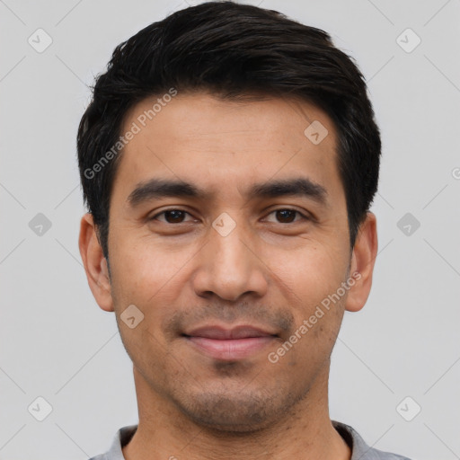 Joyful asian young-adult male with short  black hair and brown eyes