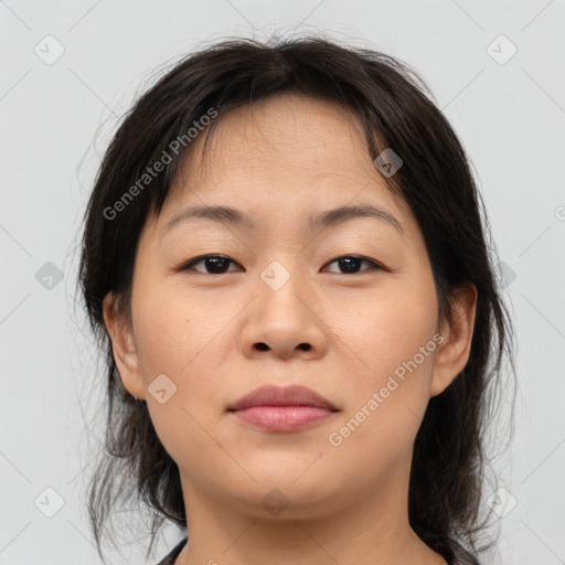 Joyful asian young-adult female with medium  brown hair and brown eyes