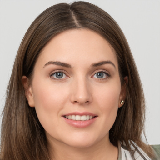 Joyful white young-adult female with long  brown hair and grey eyes