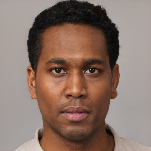 Neutral black young-adult male with short  black hair and brown eyes