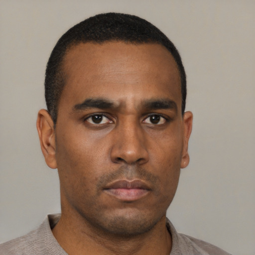 Neutral black young-adult male with short  black hair and brown eyes