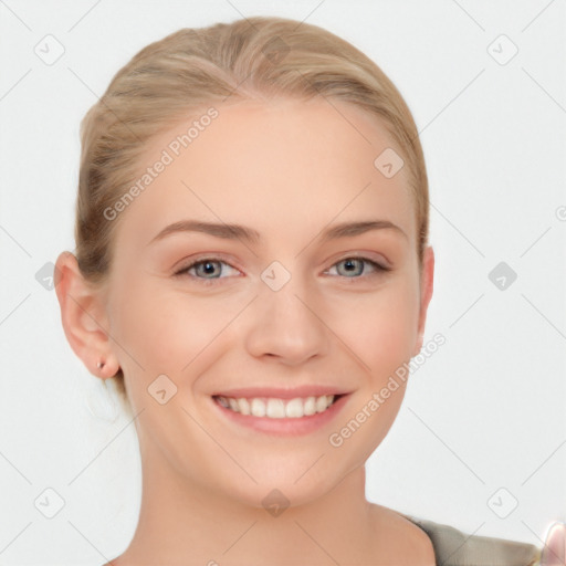 Joyful white young-adult female with long  brown hair and blue eyes