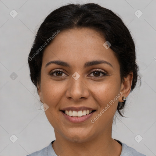 Joyful latino young-adult female with medium  brown hair and brown eyes