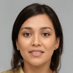 Joyful white young-adult female with medium  brown hair and brown eyes