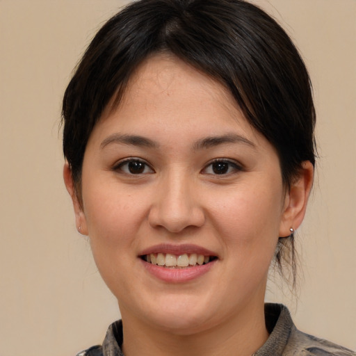 Joyful white young-adult female with medium  brown hair and brown eyes
