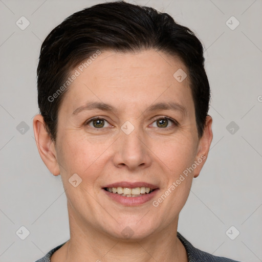 Joyful white adult female with short  brown hair and grey eyes