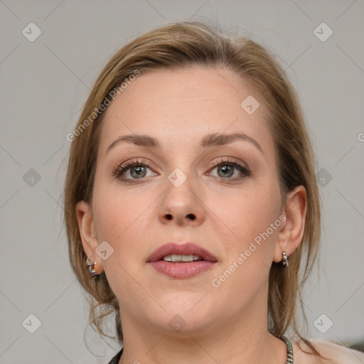 Joyful white young-adult female with medium  brown hair and grey eyes