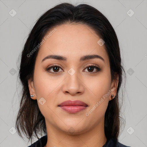 Joyful latino young-adult female with medium  brown hair and brown eyes