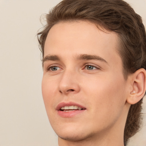 Joyful white young-adult male with medium  brown hair and brown eyes