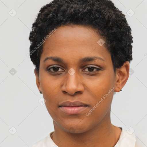 Joyful black young-adult female with short  black hair and brown eyes