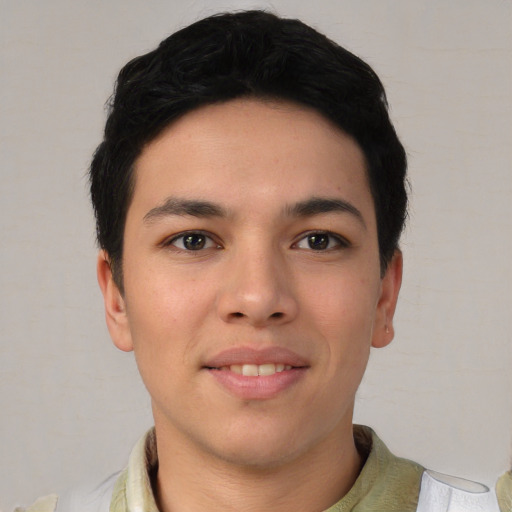 Joyful asian young-adult male with short  brown hair and brown eyes