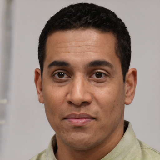 Neutral latino adult male with short  black hair and brown eyes