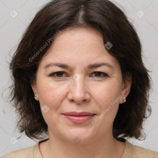 Joyful white adult female with medium  brown hair and brown eyes