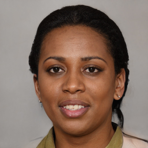 Joyful latino young-adult female with short  black hair and brown eyes