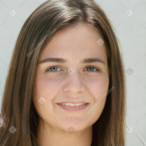 Joyful white young-adult female with long  brown hair and green eyes