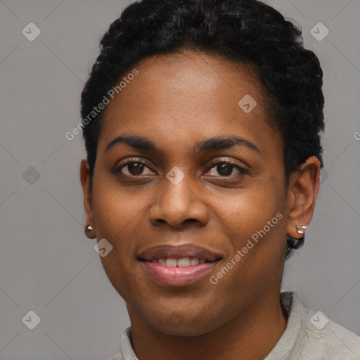 Joyful black young-adult female with short  black hair and brown eyes