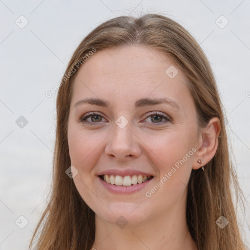 Joyful white young-adult female with long  brown hair and grey eyes