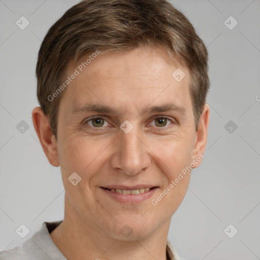 Joyful white adult male with short  brown hair and grey eyes