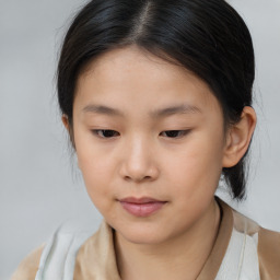 Joyful asian child female with medium  brown hair and brown eyes