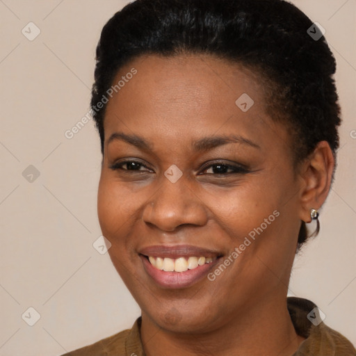 Joyful black young-adult female with short  brown hair and brown eyes