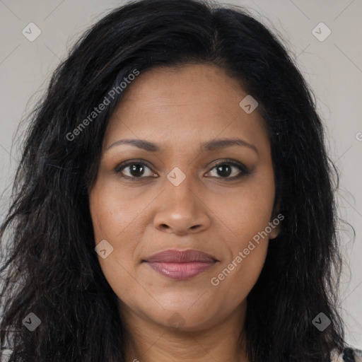 Joyful black young-adult female with long  brown hair and brown eyes