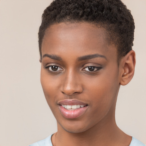 Joyful black young-adult female with short  brown hair and brown eyes