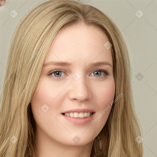 Joyful white young-adult female with long  brown hair and green eyes