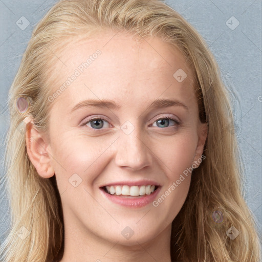 Joyful white young-adult female with long  brown hair and blue eyes