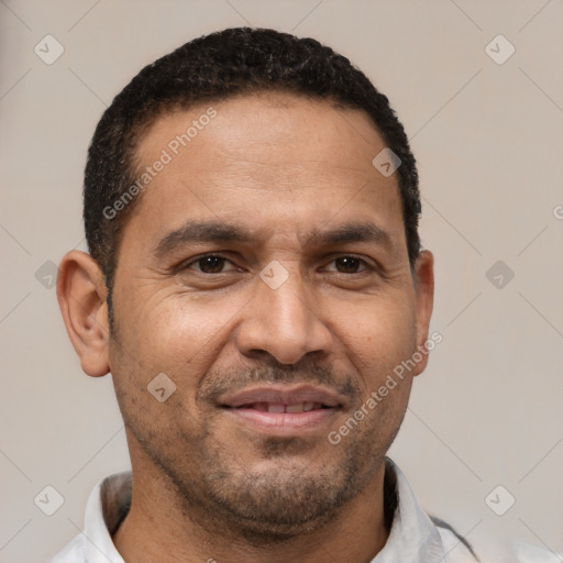 Joyful latino adult male with short  black hair and brown eyes