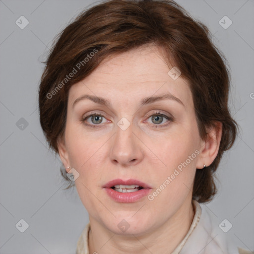 Joyful white adult female with medium  brown hair and grey eyes