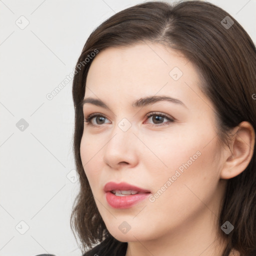 Neutral white young-adult female with long  brown hair and brown eyes