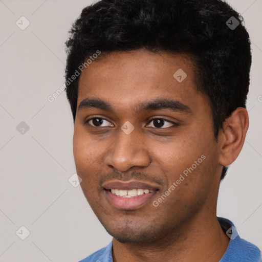 Joyful black young-adult male with short  black hair and brown eyes